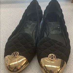 Black suede Tory Burch shoes with gold logo tip